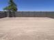 Exterior view of a backyard with block wall at 24088 W Bowker St, Buckeye, AZ 85326