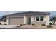 Charming single-story home with a two-car garage and low maintenance front yard at 24088 W Bowker St, Buckeye, AZ 85326