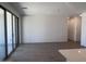 Spacious living room with tile flooring, sliding glass doors and lots of natural light at 24088 W Bowker St, Buckeye, AZ 85326