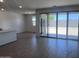 Bright living room features wood-style flooring and sliding glass doors to the outdoor space at 24088 W Bowker St, Buckeye, AZ 85326