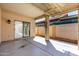 Covered back patio with a sliding glass door to home interior and view of backyard at 24824 W Pueblo Ave, Buckeye, AZ 85326