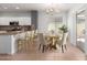 Eat-in kitchen and dining area with granite countertops and modern decor at 24824 W Pueblo Ave, Buckeye, AZ 85326