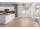 Bright kitchen and breakfast nook area with access to outdoor seating and natural light at 24824 W Pueblo Ave, Buckeye, AZ 85326