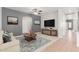 Cozy living room with a neutral color palette, artwork, and stylish furnishings at 24824 W Pueblo Ave, Buckeye, AZ 85326