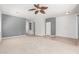 Spacious living room with carpet and tile flooring, perfect for entertaining and relaxation at 24824 W Pueblo Ave, Buckeye, AZ 85326