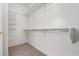 Spacious walk-in closet with shelving and ample storage for clothes and accessories at 24824 W Pueblo Ave, Buckeye, AZ 85326