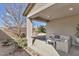 Covered back patio with comfortable seating, perfect for relaxing outdoors at 266 N Piedra Way, Mesa, AZ 85207