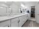Bathroom with double sinks and modern fixtures, plus a walk-in closet at 266 N Piedra Way, Mesa, AZ 85207