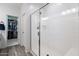 Bright bathroom featuring a glass-enclosed shower and walk-in closet at 266 N Piedra Way, Mesa, AZ 85207