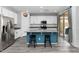 Bright kitchen with white cabinets, blue island, stainless appliances and tile floors at 266 N Piedra Way, Mesa, AZ 85207
