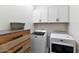 Functional laundry room with modern washer and dryer and storage at 266 N Piedra Way, Mesa, AZ 85207