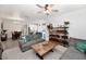 Spacious living room with comfortable seating and an open layout to kitchen and dining area at 266 N Piedra Way, Mesa, AZ 85207