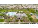 Overhead view of a community center with a pool, playground, and manicured green spaces at 2708 S Santa Rita --, Mesa, AZ 85209