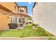 Landscaped backyard with a patio, a grill, artificial turf, and tall privacy walls at 2708 S Santa Rita --, Mesa, AZ 85209
