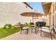 Inviting backyard with a patio, artificial grass, and comfortable patio furniture at 2708 S Santa Rita --, Mesa, AZ 85209