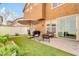 Picturesque backyard featuring a brick patio, artificial turf, and sliding glass doors at 2708 S Santa Rita --, Mesa, AZ 85209