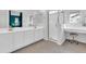 Modern bathroom featuring dual sinks, white vanity, and a glass-enclosed shower at 2708 S Santa Rita --, Mesa, AZ 85209