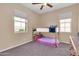 bedroom with a bunkbed, large windows, and neutral colored carpeted floors at 2708 S Santa Rita --, Mesa, AZ 85209