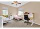 Comfortable bedroom with two twin beds, a work station, and natural light from the window at 2708 S Santa Rita --, Mesa, AZ 85209