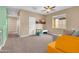 Bright bonus room with a ceiling fan, a window, and soft carpet flooring at 2708 S Santa Rita --, Mesa, AZ 85209