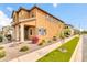 A view of a two-story house with stucco exterior and a strip of grass at 2708 S Santa Rita --, Mesa, AZ 85209