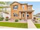 Inviting two-story home featuring a well-manicured lawn and charming exterior details at 2708 S Santa Rita --, Mesa, AZ 85209