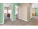 Open hallway with light green trim and multiple open doorways leading to bedrooms and other rooms at 2708 S Santa Rita --, Mesa, AZ 85209