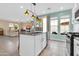 Open kitchen area with island, stainless steel appliances, granite counters, and eat in kitchen at 2708 S Santa Rita --, Mesa, AZ 85209