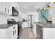 Well-equipped kitchen boasts stainless appliances, white cabinets, and granite countertops at 2708 S Santa Rita --, Mesa, AZ 85209