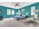 Main bedroom features a ceiling fan, plush carpet, and neutral décor at 2708 S Santa Rita --, Mesa, AZ 85209