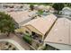 The house aerial highlights a covered patio, neutral exterior, low-maintenance landscaping, and golf course nearby at 3252 E Fremont Rd, Phoenix, AZ 85042