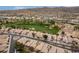 The aerial view captures the golf course community showcasing neutral colored homes, and well-manicured green landscapes at 3252 E Fremont Rd, Phoenix, AZ 85042