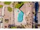 Aerial view of a pristine pool and patio area with a gazebo, lush desert landscaping, and comfortable lounge chairs at 3252 E Fremont Rd, Phoenix, AZ 85042