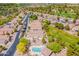 Beautiful aerial view of a community of single-Gathering homes with a nearby golf course, pool, and well-maintained landscaping at 3252 E Fremont Rd, Phoenix, AZ 85042