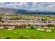 Stunning aerial view of a Primary-planned community with lush landscaping, a golf course, and mountain views at 3252 E Fremont Rd, Phoenix, AZ 85042