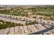 Golf course community with well-maintained landscaping, neutral-colored single Gathering homes with tile roofs at 3252 E Fremont Rd, Phoenix, AZ 85042