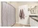 Bathroom featuring a gray patterned shower curtain and neutral-toned walls at 3252 E Fremont Rd, Phoenix, AZ 85042