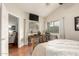 Bright bedroom offers natural light, hardwood flooring, and a view to the lush, green landscape at 3252 E Fremont Rd, Phoenix, AZ 85042