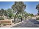Ravenswood gated community entrance with mature landscaping and stone signage at 3252 E Fremont Rd, Phoenix, AZ 85042