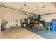 Garage with storage shelves, gym equipment, and door to outside at 3252 E Fremont Rd, Phoenix, AZ 85042