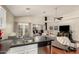 Open-concept layout connects the kitchen to the living room with hardwood floors and neutral decor at 3252 E Fremont Rd, Phoenix, AZ 85042