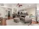 Bright open-concept living area featuring hardwood floors, stylish furniture, and ample natural light at 3252 E Fremont Rd, Phoenix, AZ 85042