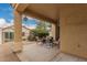 Inviting covered patio with stylish outdoor furniture, providing a relaxing space to enjoy the outdoors at 3252 E Fremont Rd, Phoenix, AZ 85042