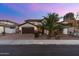 Charming two-story home featuring a landscaped front yard and a two-car garage with stone accents at 3393 E Fandango Dr, Gilbert, AZ 85298