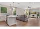 Open concept living room and kitchen featuring modern lighting fixtures and hardwood floors at 3393 E Fandango Dr, Gilbert, AZ 85298