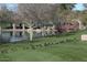 Tranquil pond with geese and a view of the park's bridge and gazebo at 3407 W Steinbeck Dr, Anthem, AZ 85086