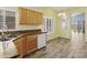 Bright eat-in kitchen features granite countertops, wood cabinets, and stainless steel appliances at 3407 W Steinbeck Dr, Anthem, AZ 85086