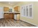 Bright kitchen featuring wood cabinets, granite counters, and a large window for ample natural light at 3407 W Steinbeck Dr, Anthem, AZ 85086
