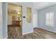 Stylish living area with hardwood-look flooring, opening up to the adjacent, well-lit kitchen at 3407 W Steinbeck Dr, Anthem, AZ 85086