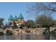 Playground with colorful turrets and slides, set amongst rocks and a pond at 3407 W Steinbeck Dr, Anthem, AZ 85086